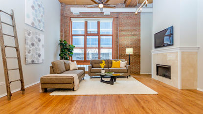 home staging of living and dining room in loft located in river north neighborhood of chicago
