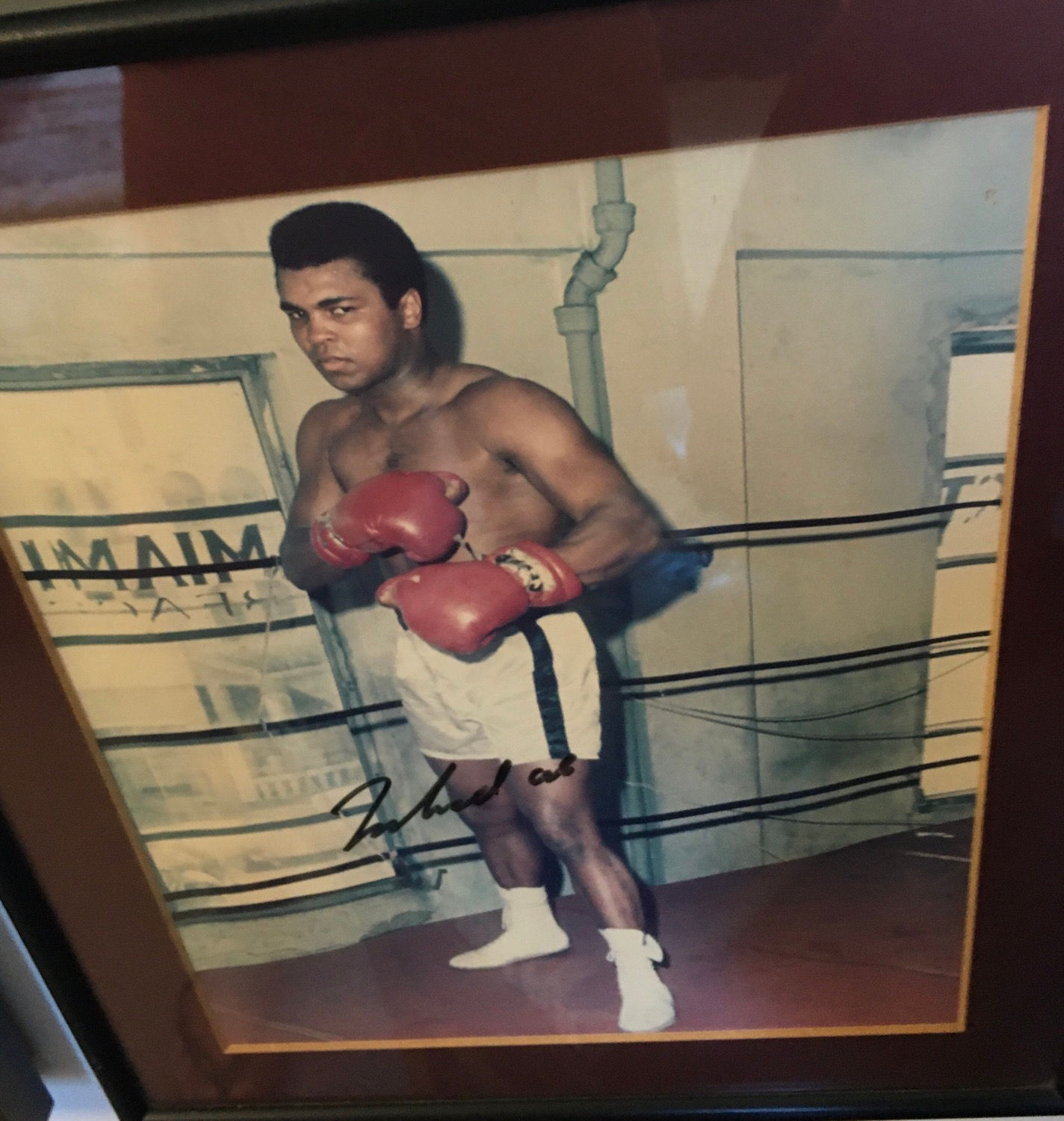Framed Muhammad Ali photo with COA.