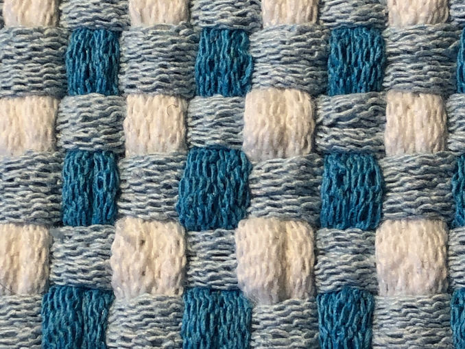 A blue gingham potholder