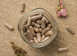 A jar of encapsulated placenta pills shot from above, which help during postpartum._.jpg