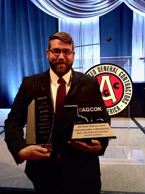 Stava Building Project Manager Justin Session accepts two awards at the annual AGCOK awards ceremony