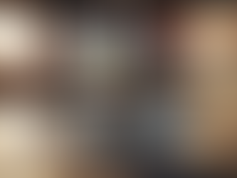 Team collaborates in a modern office with a large screen showing app designs. Text reads "Mobile App Development Costs in Georgia 2026."