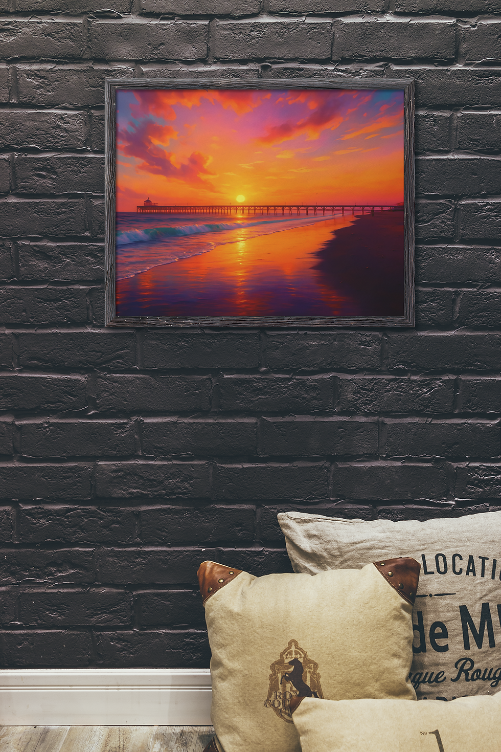 Thumbnail: Ocean pier wall art framed on dark brick wall with coastal decor and tan cushions
