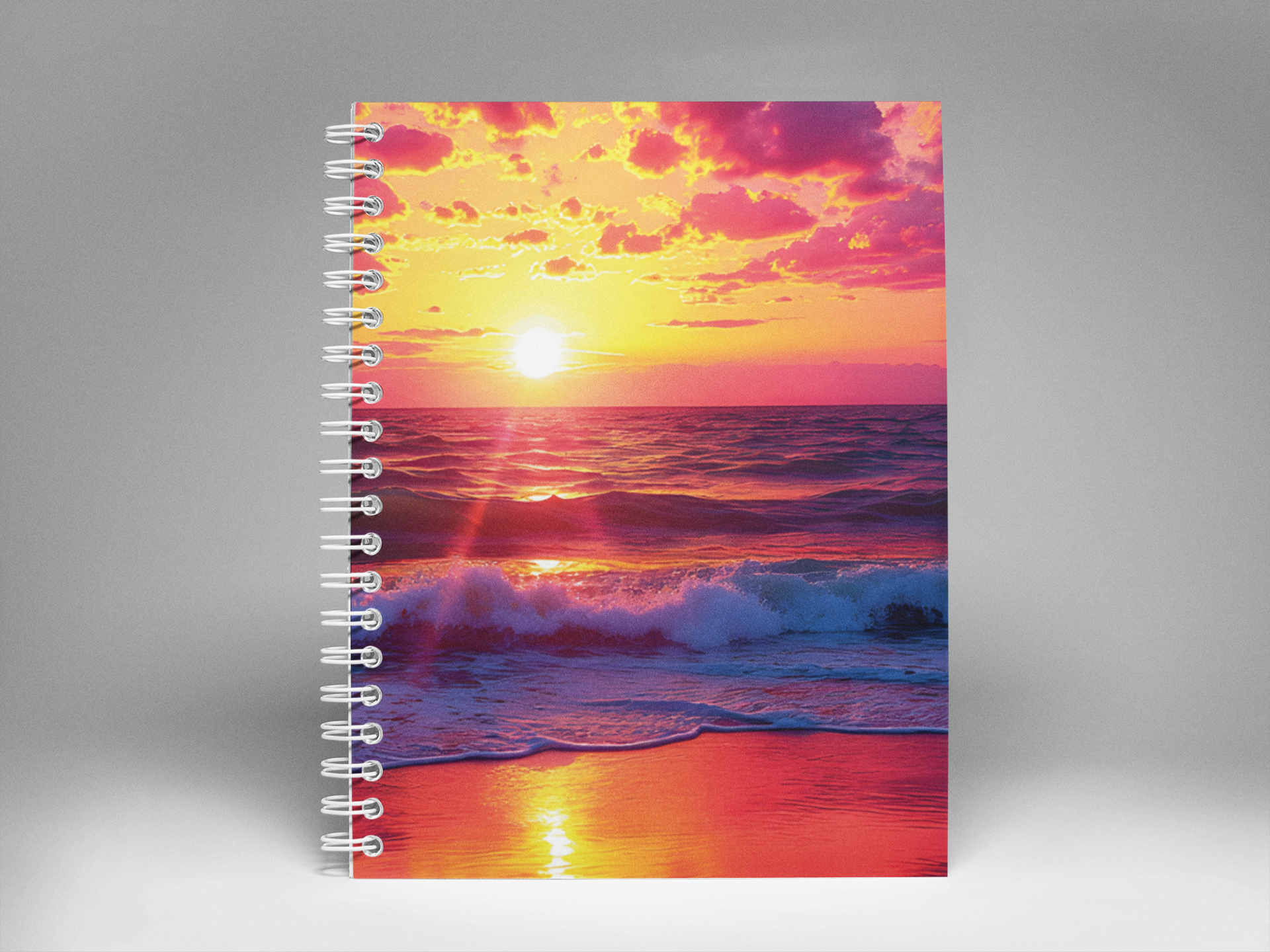 Evening Glow sunset spiral notebook photographed standing on gray background.