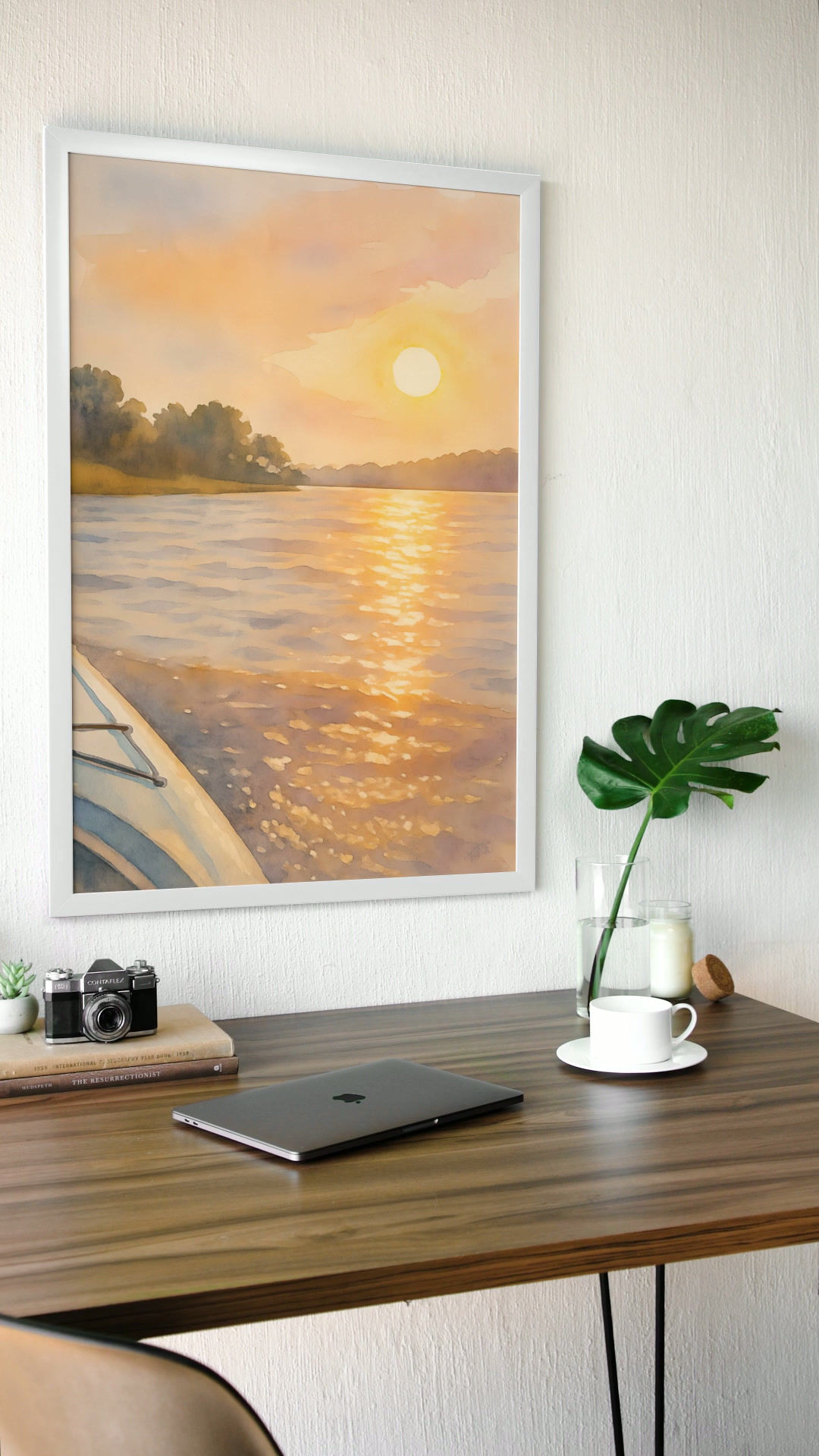 Framed Sunset Sketch digital art hanging on white office wall with potted plant.