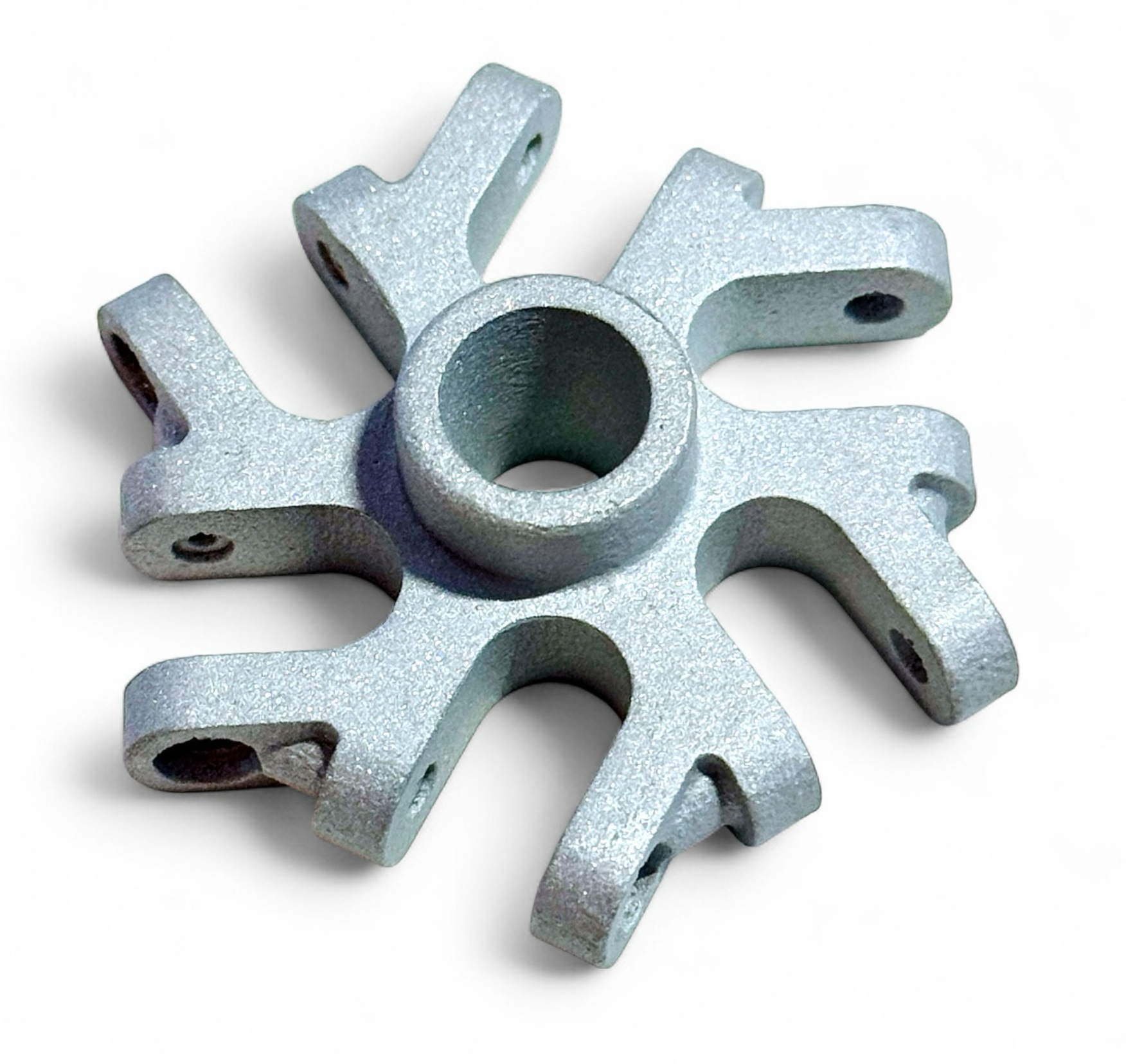 Metal 3D printed component with a central bore and radial mounting arms on a white background
