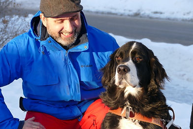 This is a photo of Laurence and his dog Moby on snow