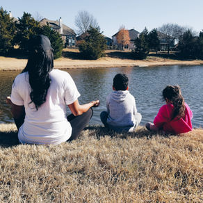 mom meditating with her kids