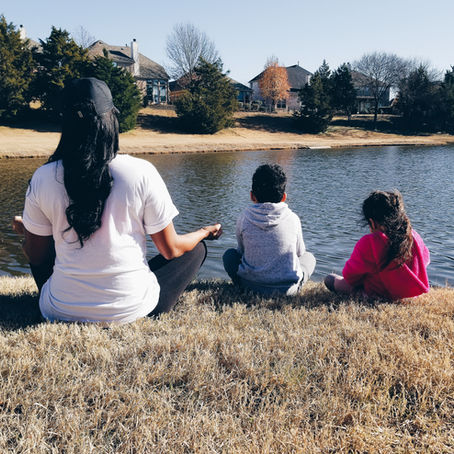 mom meditating with her kids