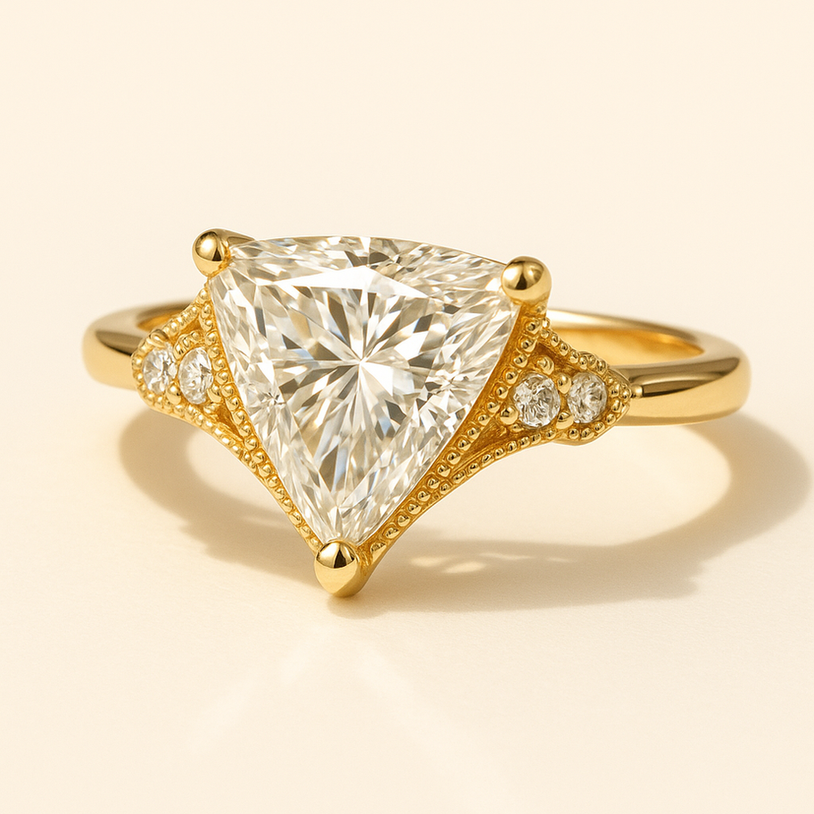 Unique engagement ring featuring a striking trillion-cut diamond with vintage-inspired diamond accents in a gold setting by O