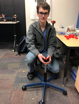 Dakota placing part in chair.jpg