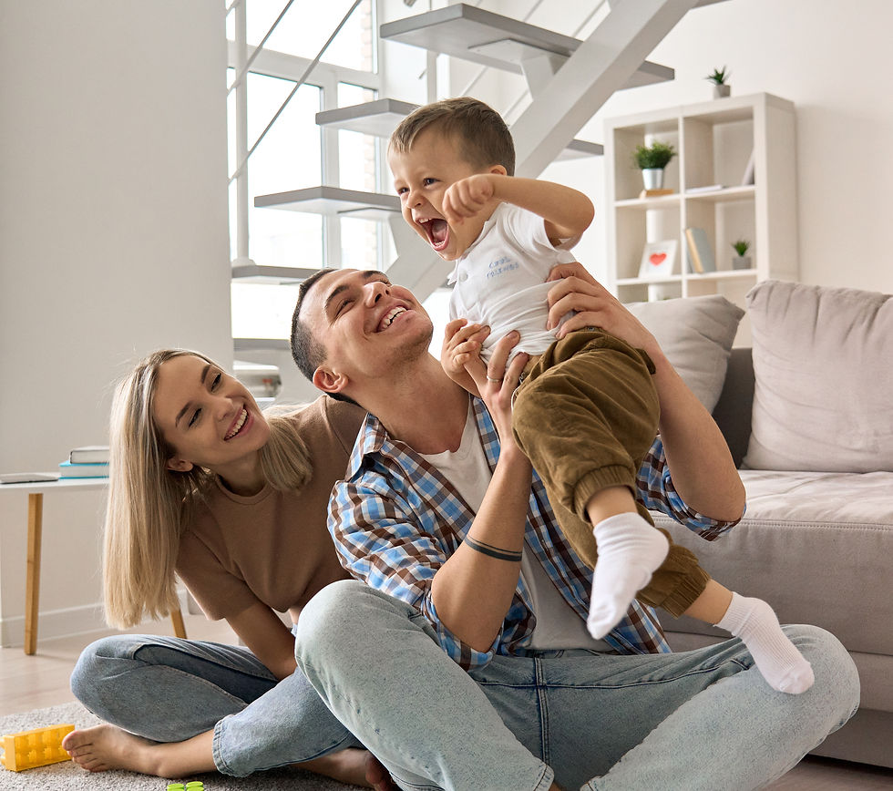 Family smiling and sitting on the couch