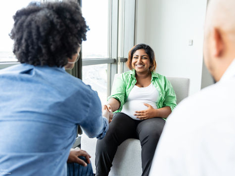 Pregnant Woman Meeting with Healthcare Professionals. Source: Getty Images. Credit: SDI Productions