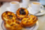 Traditional Portuguese pastel de natas with coffee.