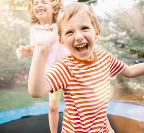 Children Jumping on Trampoline