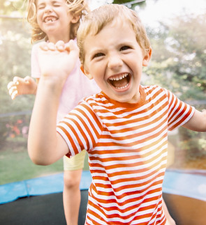 Children Jumping on Trampoline
