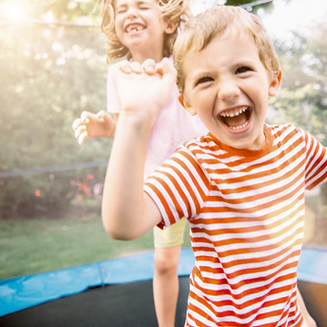 Children Jumping on Trampoline