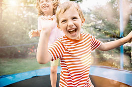 Children Jumping on Trampoline