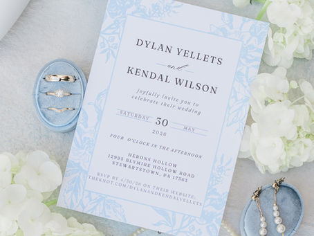 An image of the couple's wedding invitation and wedding details taken by Molly Kate Photography a central Pennsylvania and East Coast Photographer