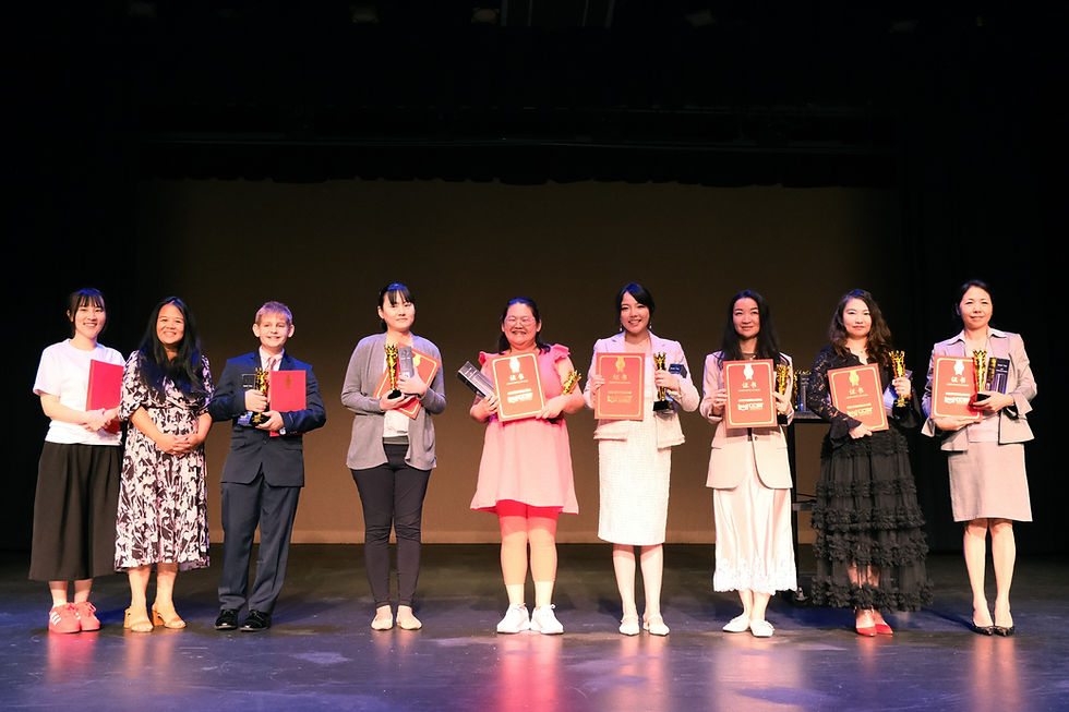 Outstanding Organization Award recipients are honored on stage. Peggy Tsai, an educator from Minnesota, is pictured fourth from the left.