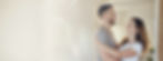 freepik_a-warm-natural-lifestyle-image-of-a-happy-couple-standing-in-the-doorway-of-their-