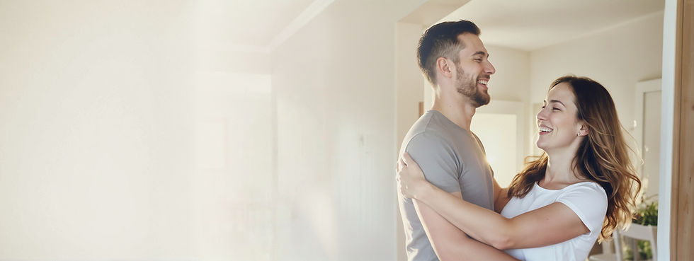 freepik_a-warm-natural-lifestyle-image-of-a-happy-couple-standing-in-the-doorway-of-their-