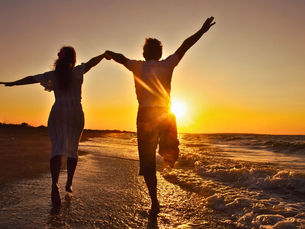 Summer love at sunset a couple at the beach