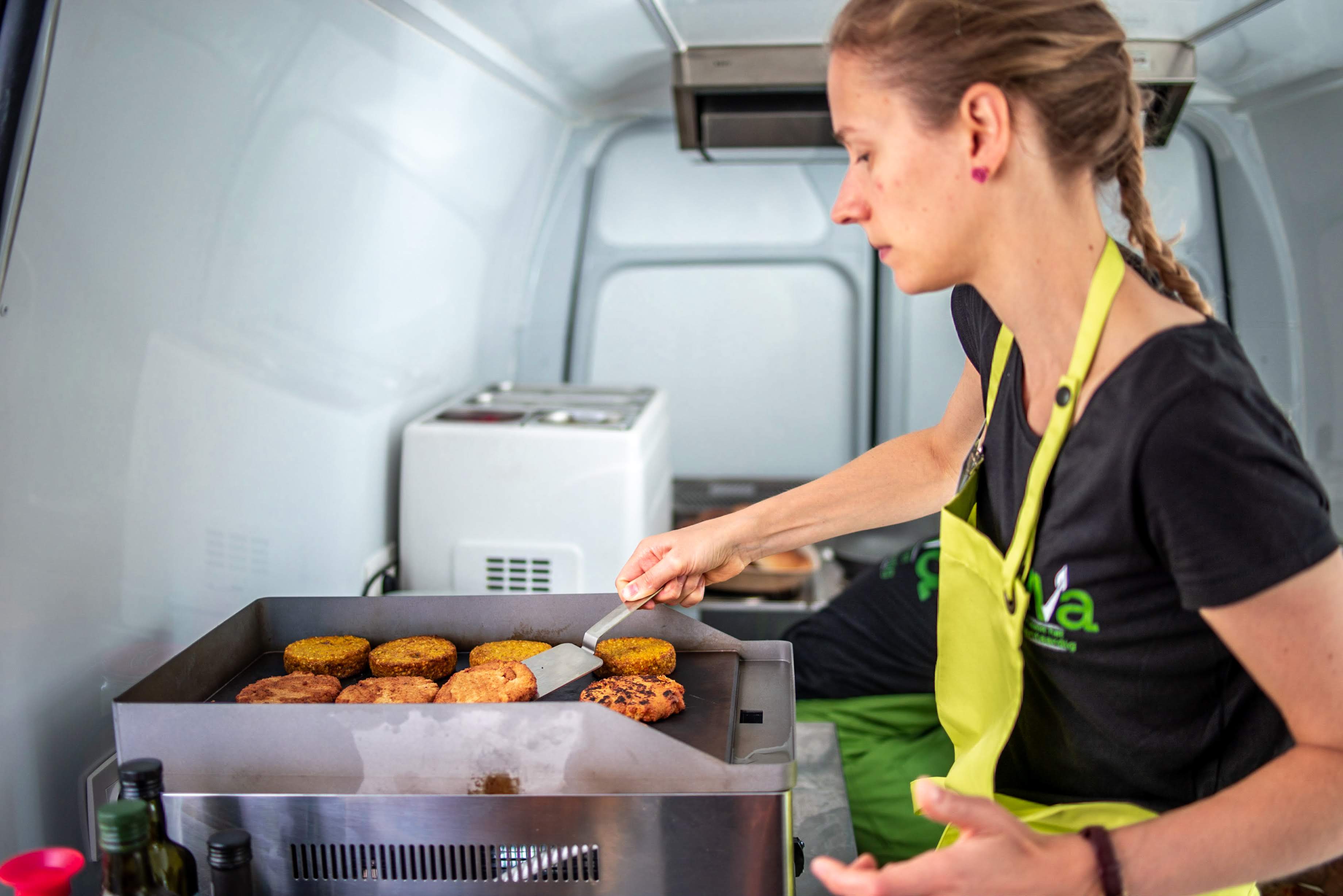 Sarah flipping the burgers