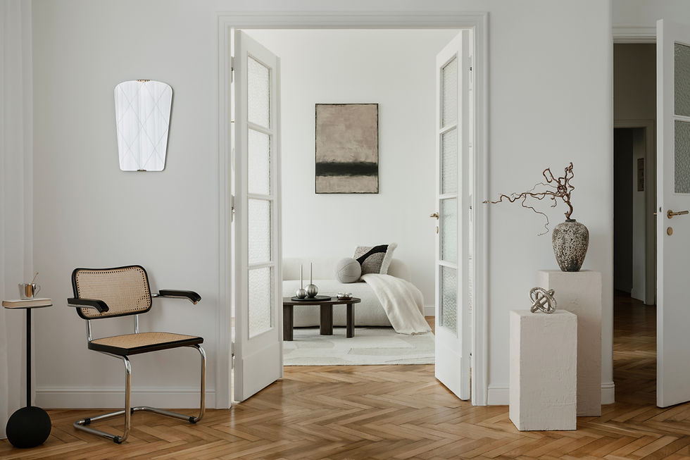 Elegant space with a minimalist cane chair, sculptural decor, and soft tones A serene blen
