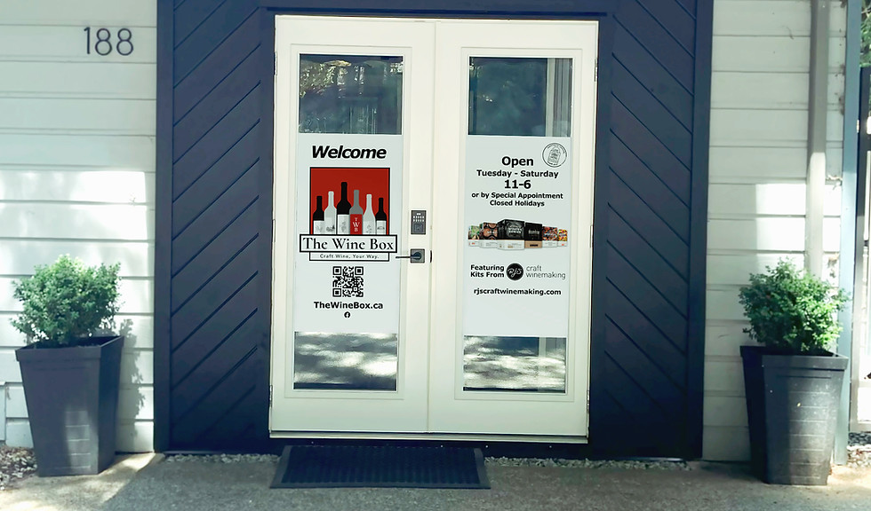 The Wine Box Boutique entrance doors, on a sunny day.