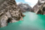 Turquoise lake surrounded by rugged mountains in Kyrgyzstan