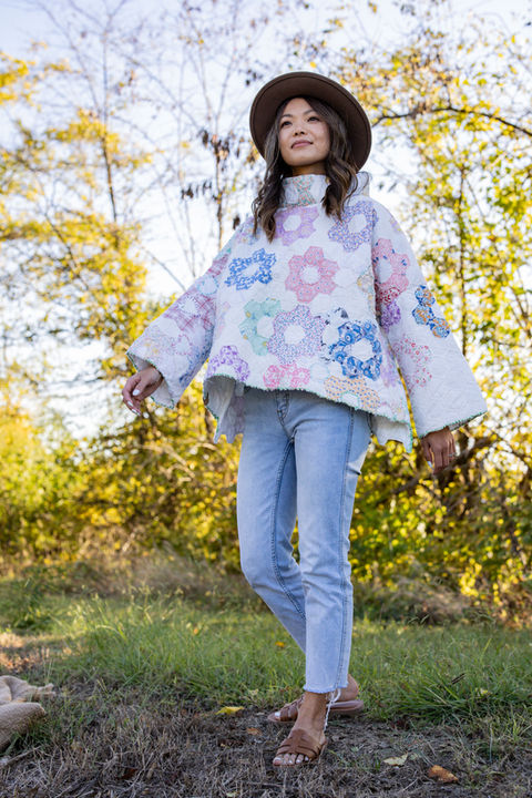 A woman in a floral quilt jacket.