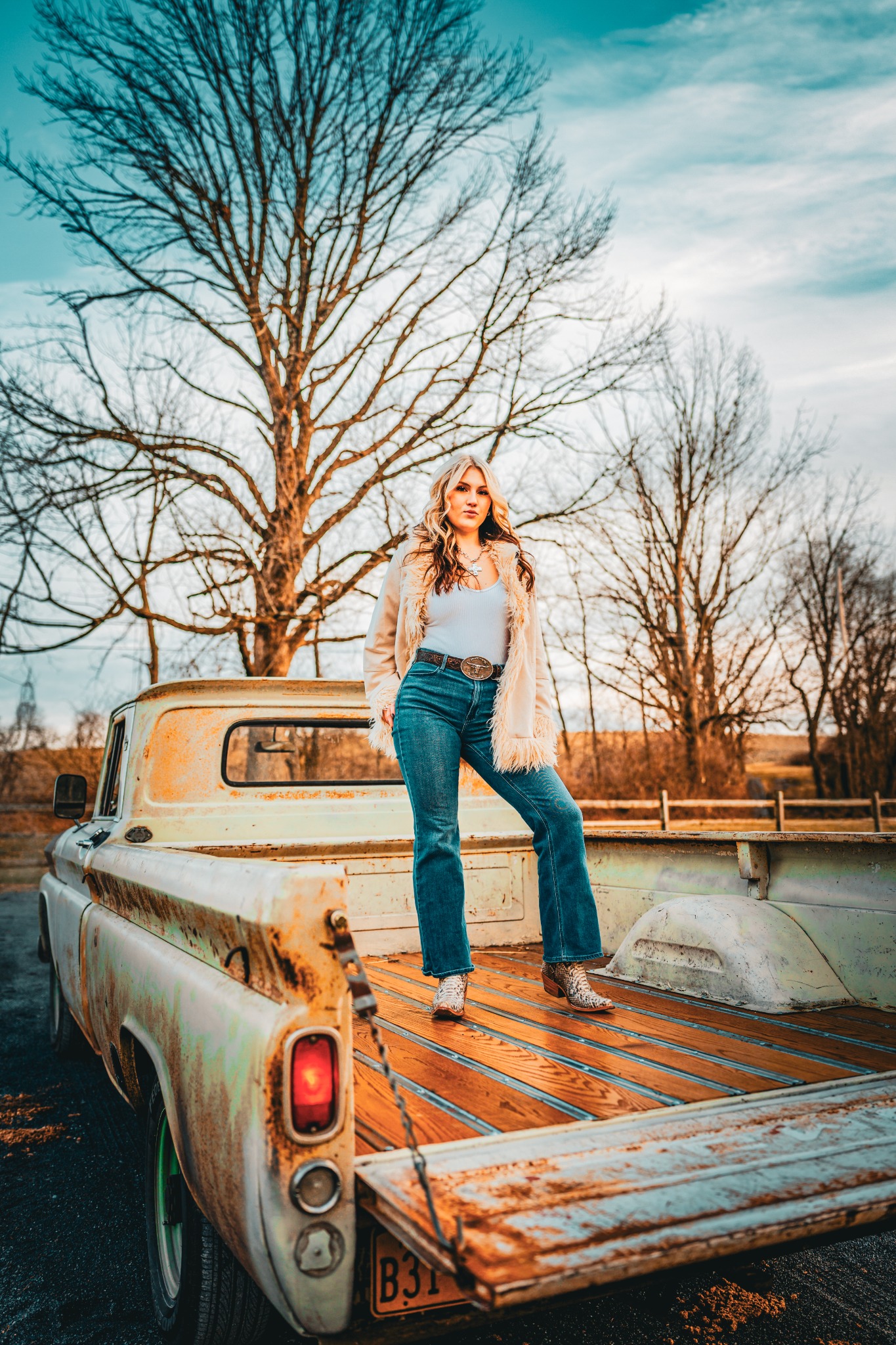 Lilly Moss portrait in a vintage pickup truck