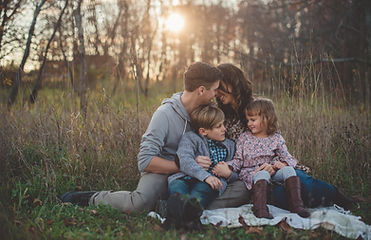 Parents sitting at sunset