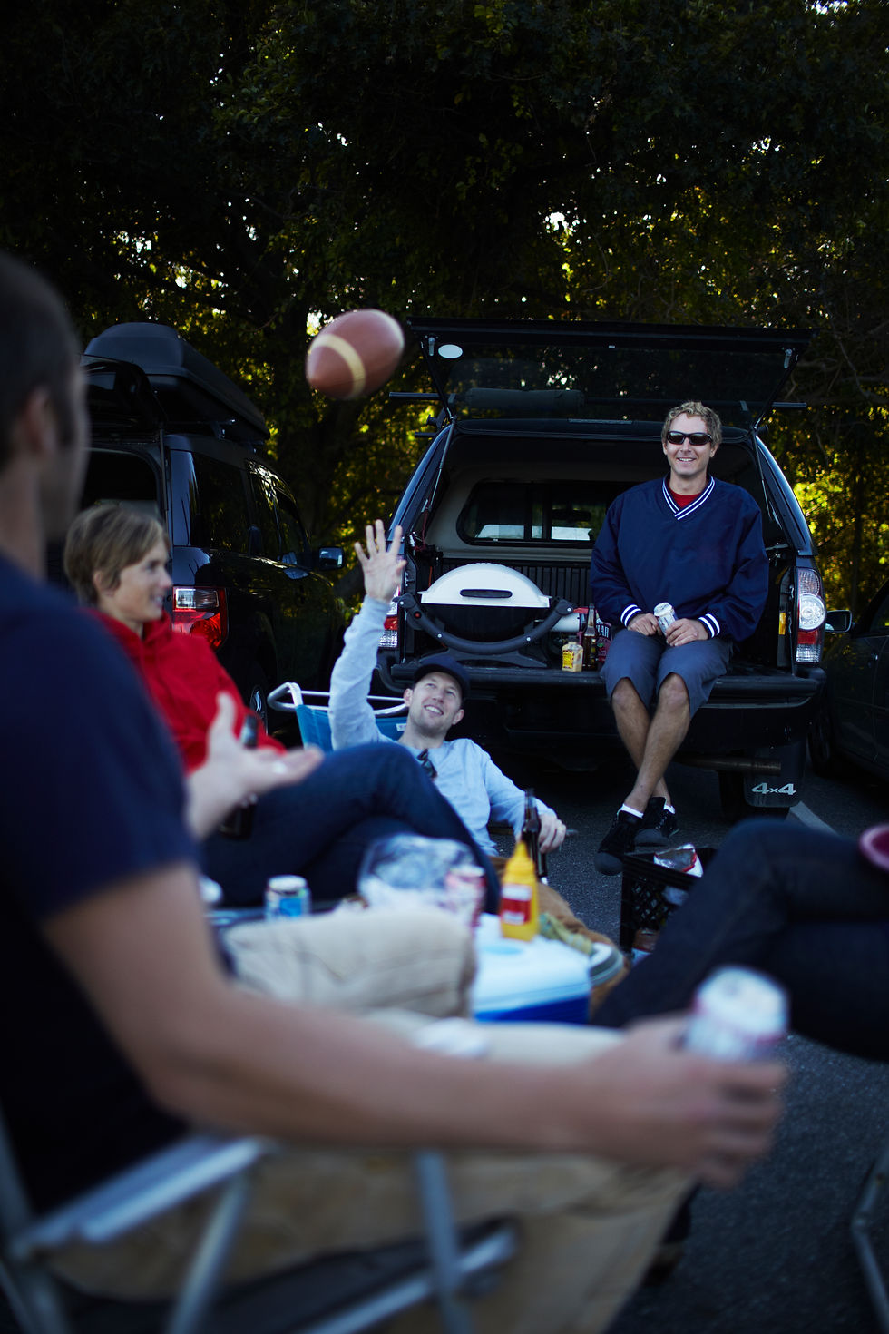 friends-enjoying-a-tailgate-party-with-football-2026-03-25-02-46-49-utc.jpg