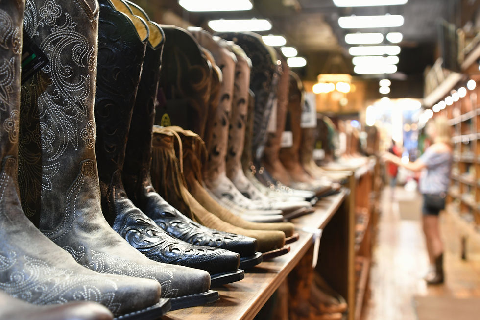 a-woman-shopping-for-cowboy-boots-in-a-retail-shoe-2026-01-09-00-36-01-utc.jpg