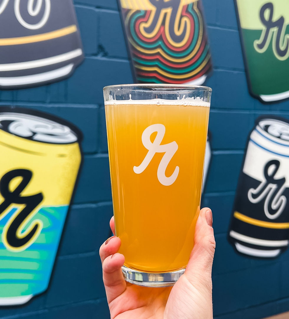Hazy IPA craft mural in front of outdoor mural wall at Reuben's Brews in Seattle's Ballard Brewery District.