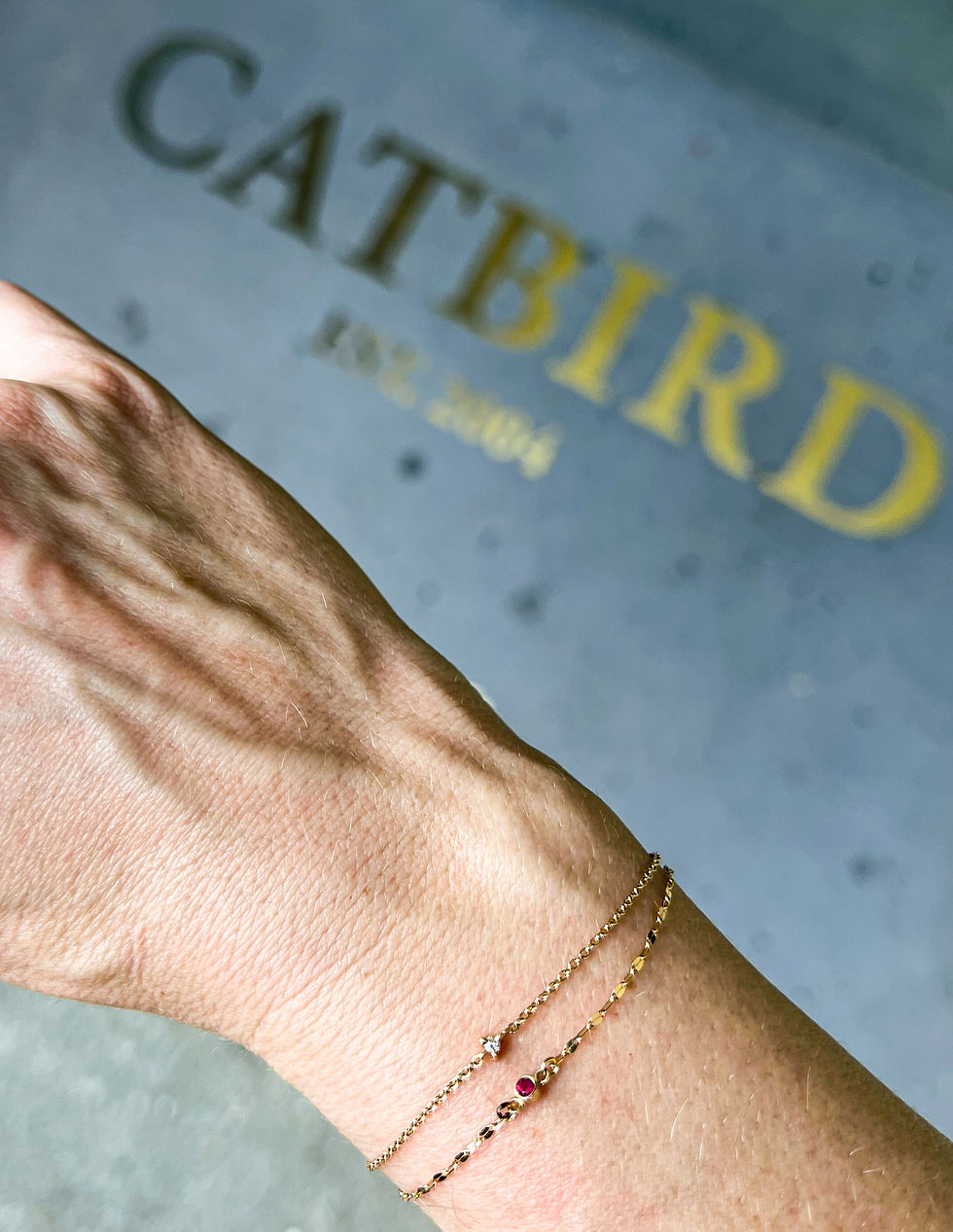 Two gold permanent bracelets zapped at Catbird in New York City
