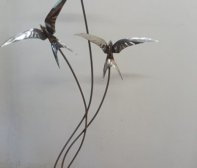 3 swallows flying for freedom