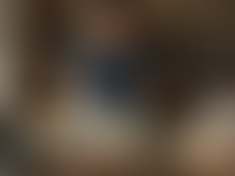 Artist arranging resin molds in attic studio