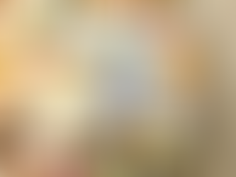 Artist pouring resin onto canvas in studio