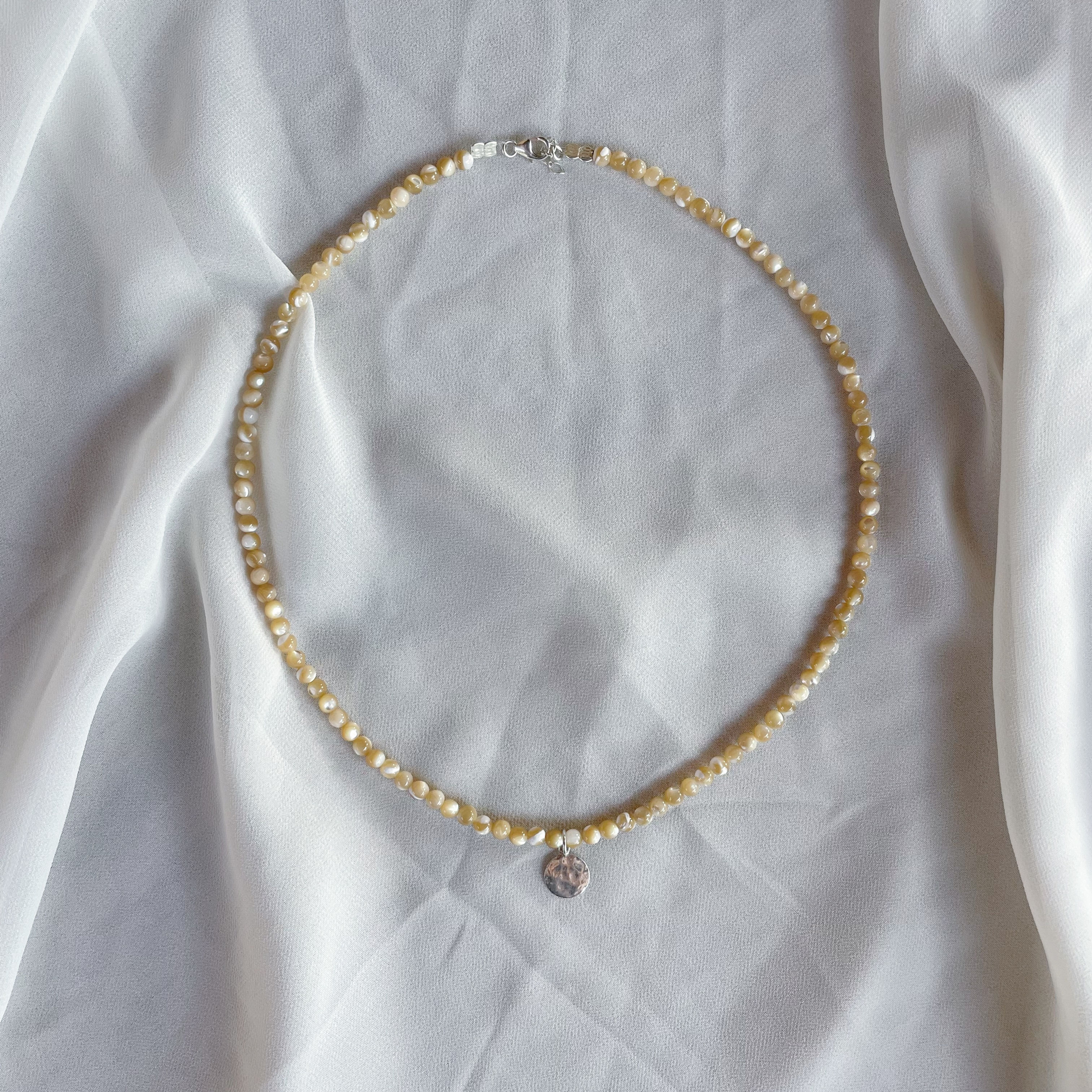 The coolest necklace beige