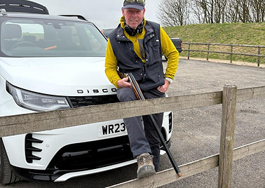 Andy by car with gun.jpg