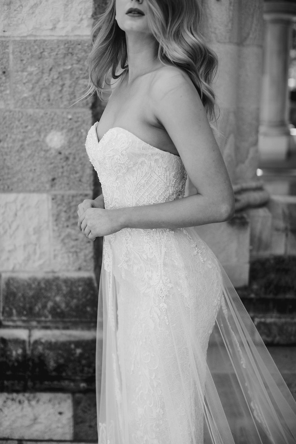 Thumbnail: Side view of ‘ella’ by Jack Sullivan Bridal fitted strapless gown with beaded lace and tulle overlay