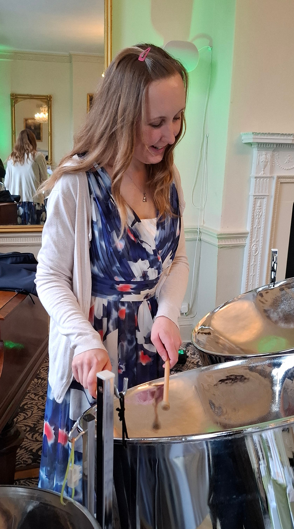 Rebekah playing steel pan at a wedding event in West Sussex