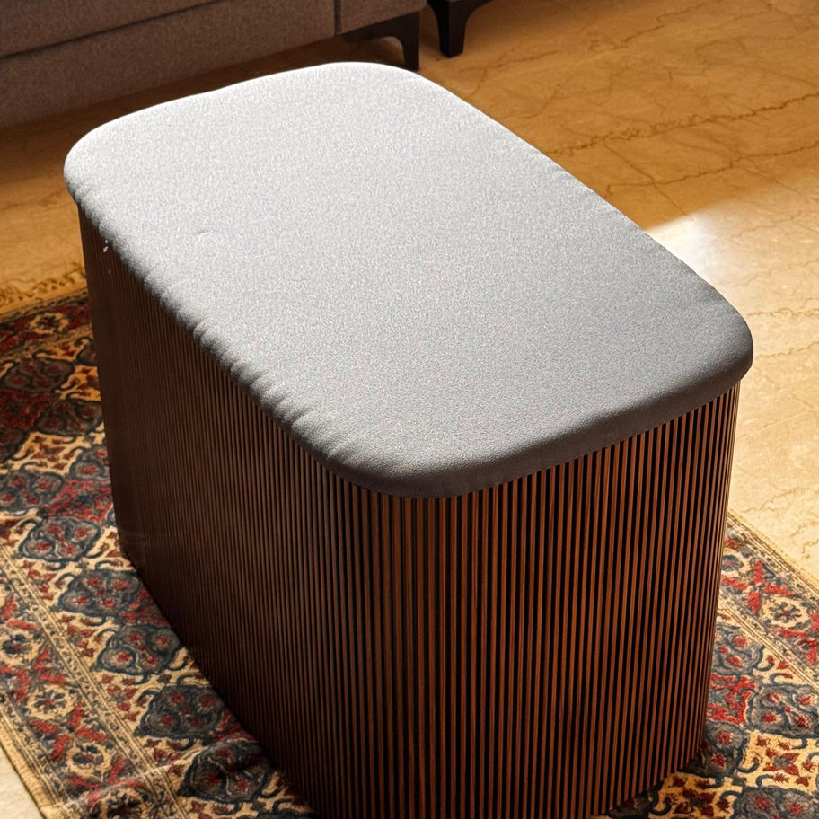 Large Luxury Ottoman with unique fluted finish and upholstery.