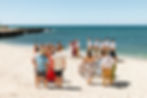 Couple holds microwedding on a beach in hawaii with immediate family with Oahu Officiant Nicole Van Diver