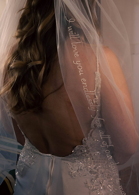 Bride shows off custom veil during Oahu wedding