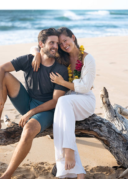 drake wallace and nicole van diver founders of oahu officiant pose on the beach