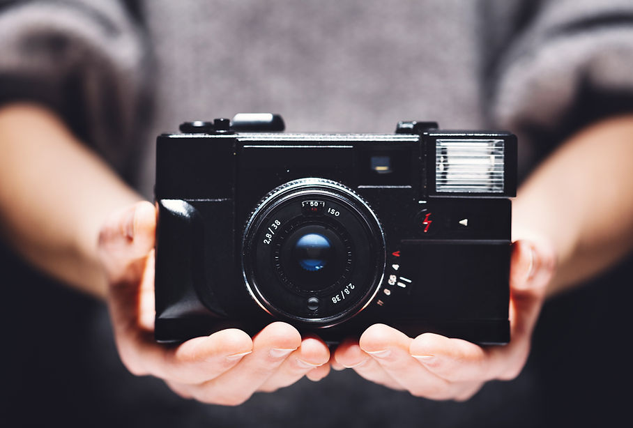 retro-camera-in-woman-s-hands-photography-2022-12-16-11-10-56-utc.jpg